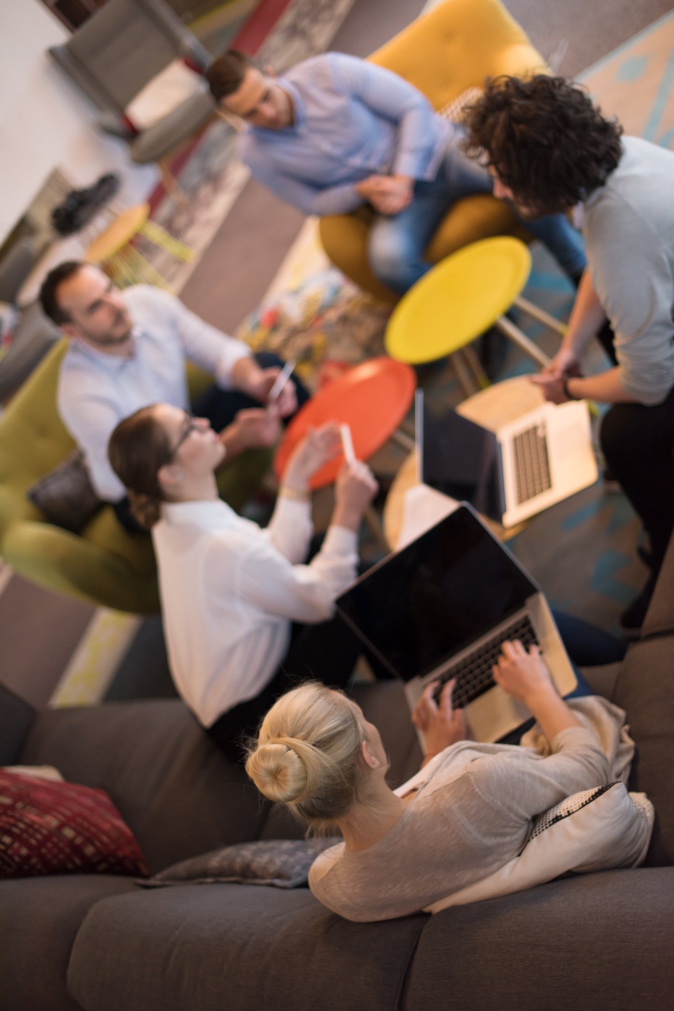 Group of young professionals co-working in an office