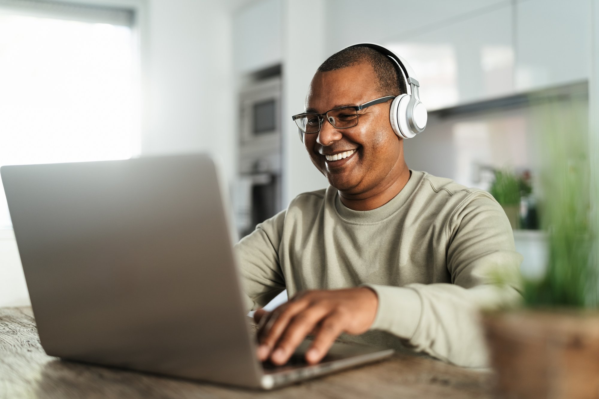 Mature man using laptop at home