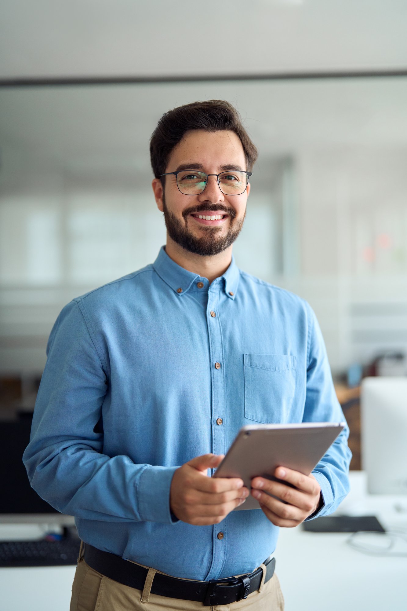 Smiling man using tablet