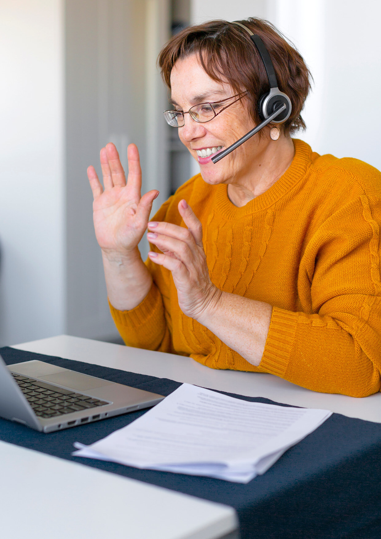 Customer service agent talking on the phone using a headset