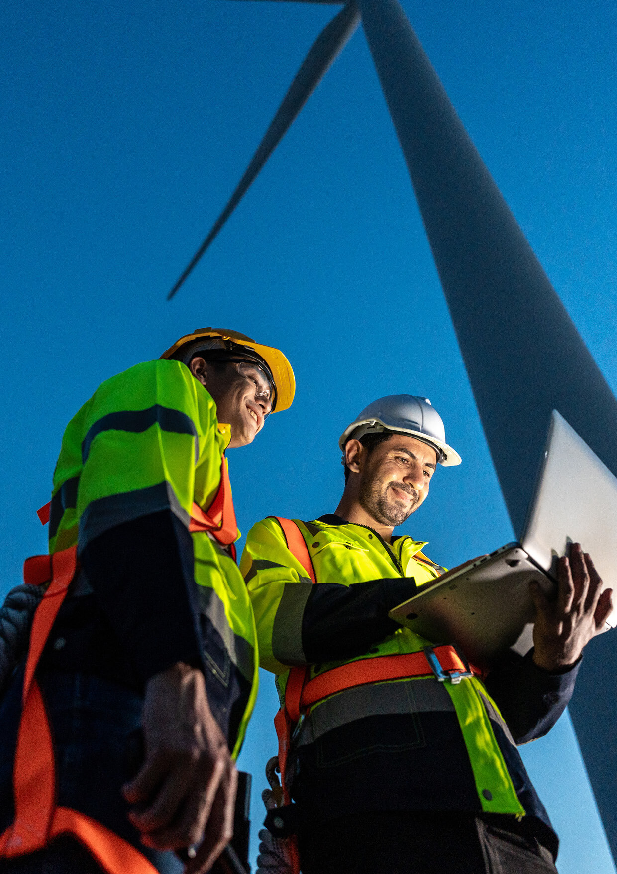 How We Help_Hero_Technicians working in wind turbines field