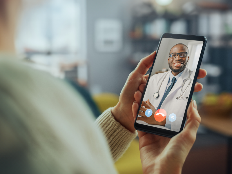 A person having a videocall with a doctor