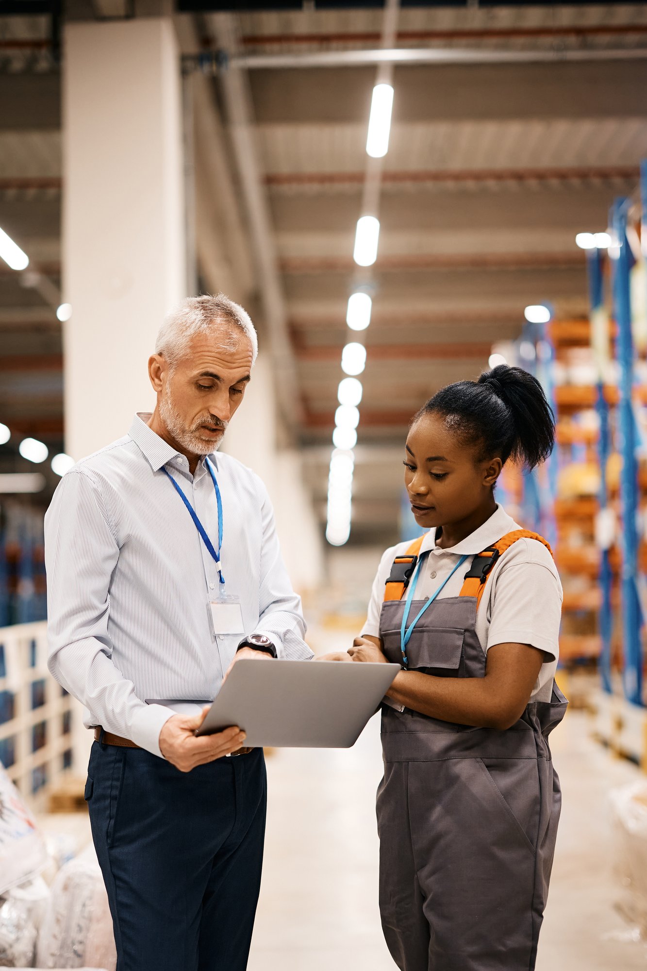 Warehouse worker working laptop